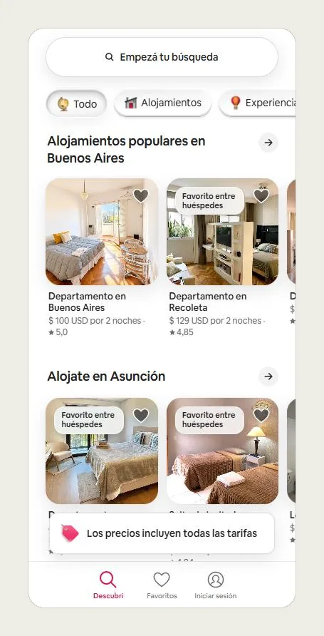 Portada de Airbnb en celular con la búsqueda arriba y la barra fija de abajo con Descubrí, Favoritos e Iniciar sesión